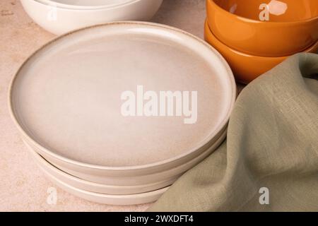 A selection of tableware on a brown stone tabletop. Stock Photo