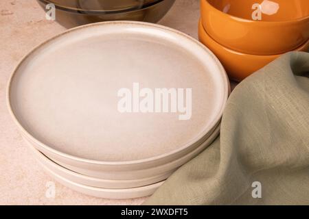A selection of tableware on a brown stone tabletop. Stock Photo