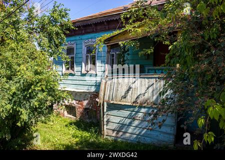 A fragment of an old house of the late 19th - early 20th century with a brick basement in the city of Borovsk, Kaluzhskiy region, Russia Stock Photo