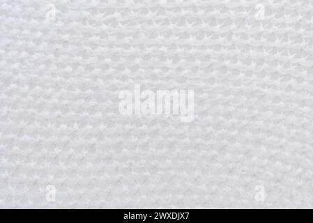 Texture of white mesh fabric. Background of light mesh fabric Stock Photo
