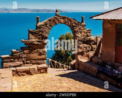 Amazing landscape on island Taquile with typical stone arch, Lake Titicaca, Puno region, Peru Stock Photo