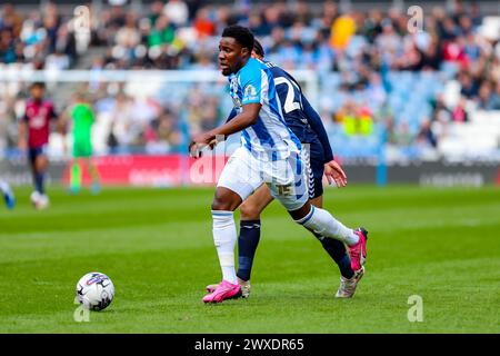 Jaheim Headley of Huddersfield Town runs on the ball during the Sky Bet ...