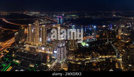 A picture of the buildings of the Downtown Dubai and Business Bay districts at night. Stock Photo