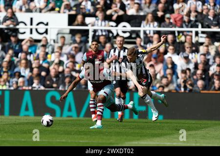 West Ham United's Mohammed Kudus battles for possession with Emil Krafth of Newcastle United during the Premier League match between Newcastle United and West Ham United at St. James's Park, Newcastle on Saturday 30th March 2024. (Photo: Mark Fletcher | MI News) Credit: MI News & Sport /Alamy Live News Stock Photo