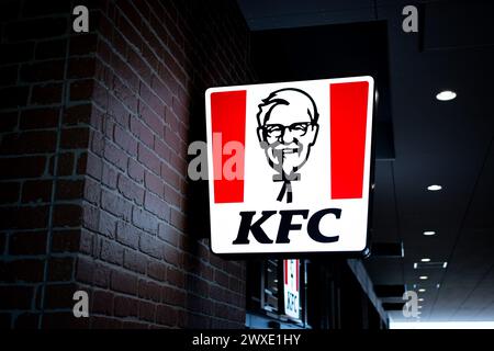 KFC sign and logo on a building wall - close up shot Stock Photo