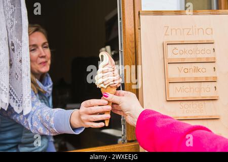 Zbysov, Czech Republic. 30th Mar, 2024. Woman selling ice cream on a warm spring day, March 30, 2024, Zbysov, Brno district, South Moravian Region. Credit: Patrik Uhlir/CTK Photo/Alamy Live News Stock Photo