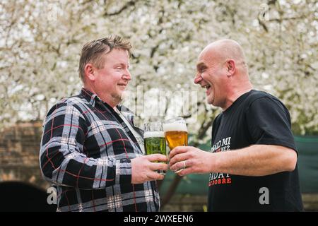 Zbysov, Czech Republic. 30th Mar, 2024. Men drinking beer on a warm spring day, March 30, 2024, Zbysov, Brno district, South Moravian Region. Credit: Patrik Uhlir/CTK Photo/Alamy Live News Stock Photo