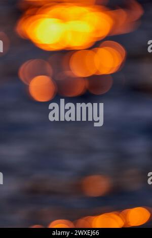 Gilded Ripples Dance Upon Molten Waters Stock Photo