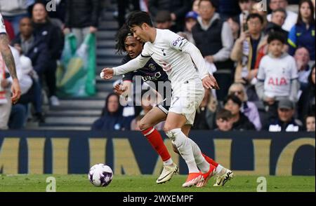 LONDON, ENGLAND - MARCH 30: Son Heung-Min of Tottenham Hotspur under pressure from Tahith Chong of Luton Town during the Premier League match between Tottenham Hotspur and Luton Town at Tottenham Hotspur Stadium on March 30, 2024 in London, England.(Photo by Dylan Hepworth/MB Media) Stock Photo