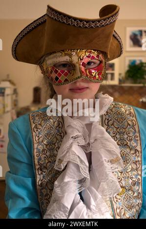 Girl, 10 years old, with carnival mask, Mecklenburg-Western Pomerania, Germany Stock Photo