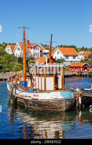 Old fishing boat at the jetty in an old fishing village on the Swedish west coast, Hamburgsund, Bohuslaen, Sweden Stock Photo