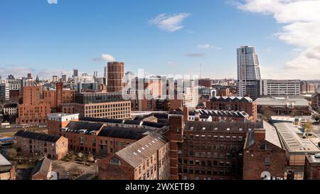 LEEDS, UK - MARCH 29, 2024. .  An aerial panoramic view of converted warehouse offices and apartments in a Leeds cityscape skyline with Granary Wharf Stock Photo