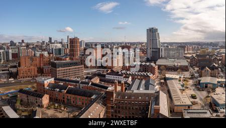 LEEDS, UK - MARCH 29, 2024. .  An aerial panoramic view of converted warehouse offices and apartments in a Leeds cityscape skyline with Granary Wharf Stock Photo