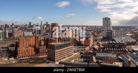 LEEDS, UK - MARCH 29, 2024. .  An aerial panoramic view of converted warehouse offices and apartments in a Leeds cityscape skyline with Granary Wharf Stock Photo