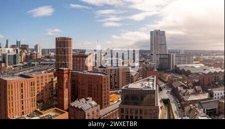 LEEDS, UK - MARCH 29, 2024. .  An aerial panoramic view of converted warehouse offices and apartments in a Leeds cityscape skyline with Granary Wharf Stock Photo