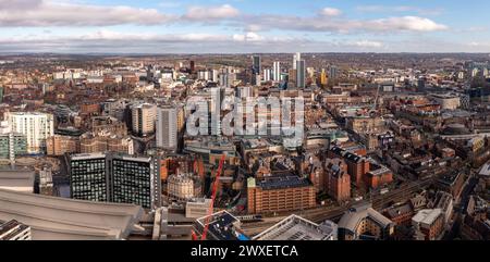 LEEDS, UK - MARCH 29, 2024. .  An aerial panoramic view of Leeds city centre with shopping and retail districts next to Leeds train station Stock Photo