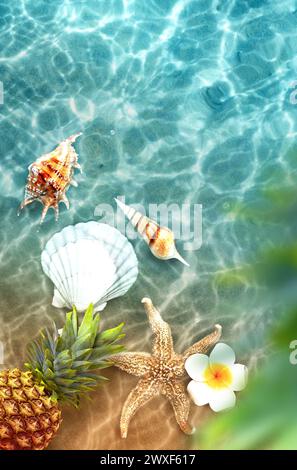 Yellow pineapple, seashells and white flowers on a blue water background. Exotic concept. Stock Photo