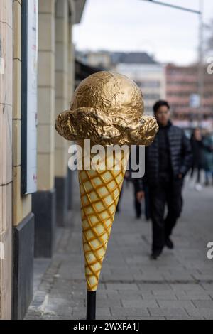 A Giant Ice Cream Cone attracting people to Gelateria in Cologne on a spring day Stock Photo