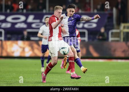 Brussels, Belgium. 30th Mar, 2024. Antwerp's Zeno Van Den Bosch and Anderlecht's Luis Vazquez fight for the ball during a soccer match between RSC Anderlecht and Royal Antwerp FC, Saturday 30 March 2024 in Brussels, on day 1 (out of 10) of the Champions' Play-offs of the 2023-2024 'Jupiler Pro League' first division of the Belgian championship. BELGA PHOTO BRUNO FAHY Credit: Belga News Agency/Alamy Live News Stock Photo