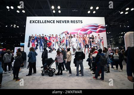 New York, USA. 30th Mar, 2024. Visitors stand in line to play at an activity center at the Toyota pavilion on Day 2 of the 2024 New York International Auto Show at the Jacob Javits Convention Center, New York, NY, March 30, 2024. (Photo by Anthony Behar/Sipa USA) Credit: Sipa USA/Alamy Live News Stock Photo