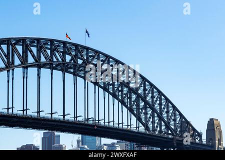 Australian national flag and Aboriginal flag flying on Sydney Harbour Bridge, Sydney, Australia, Tuesday, March 12, 2024. Stock Photo