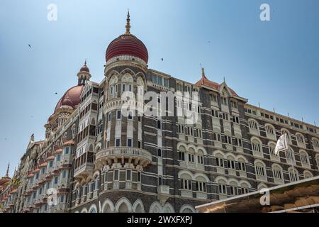 Taj Mahal hotel famous building of touristic part in Mumbai, India. Facade of The Taj Mahal Palace hotel in Colaba district. Travel photo, street view Stock Photo