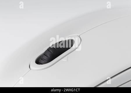 Black corrugated wheel of a light computer mouse close-up Stock Photo