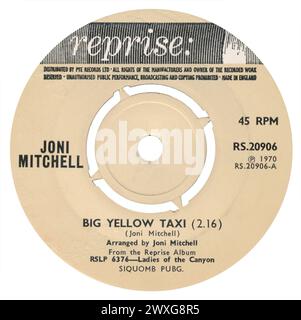 45 RPM 7' UK record label of Big Yellow Taxi by Joni Mitchell on the Reprise label from 1970. Written, arranged and produced by Joni Mitchell. Stock Photo