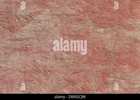 Red Paint Press Wood Texture Osb Background Building Material Surface Construction Surface Structure. Stock Photo