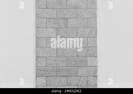 Grey sand brickwork brick masonry wall sample object on white background architecture facade exterior building background. Stock Photo