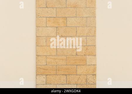 Light yellow sand wall brick blocks masonry shell texture background object design. Stock Photo