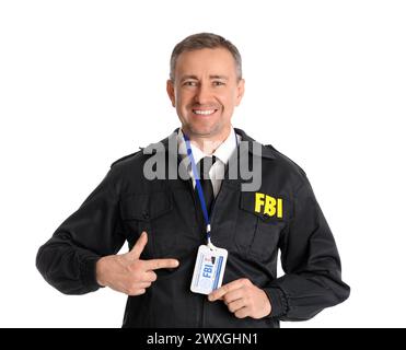 Mature FBI agent pointing at document on white background Stock Photo