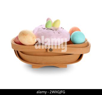 Basket with Easter cake and painted eggs isolated on white background Stock Photo