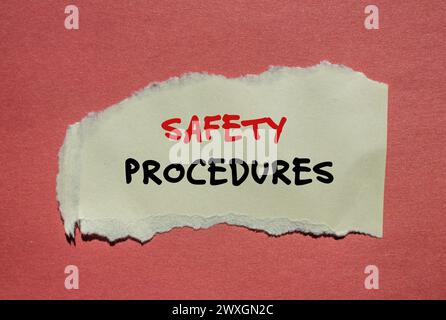 Safety procedures words written on green torn paper pieces with red ...