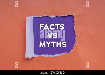 Facts vs myths words written on orange torn paper with purple background. Conceptual symbol. Copy space. Stock Photo