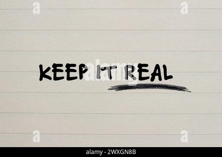 Keep it real words written on notebook page. Conceptual symbol. Copy space. Stock Photo