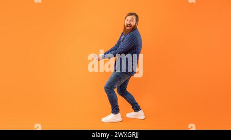 Man With Beard Holding Hands Together With Palms Up, Studio Stock Photo
