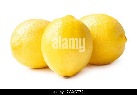 Three whole fresh beautiful yellow lemons in stack is isolated on white background with clipping path. Stock Photo