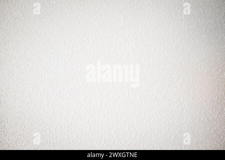white painted woodchip wallpaper texture pattern backgroung. Stock Photo