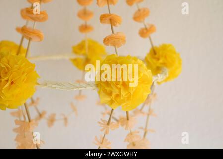 Paper mobile close-up, a craft for hanging a mobile above a crib or decorated room ceiling. Handmade creative home decor. Stock Photo