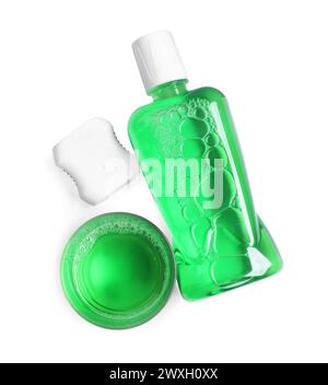 Fresh mouthwash, bottle, glass and dental floss isolated on white, top view Stock Photo