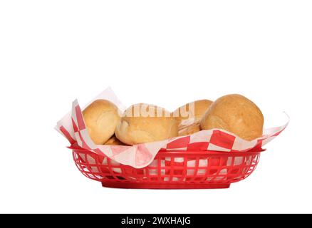 Basket filled with freshly baked buns on a white backdrop Stock Photo