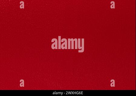 Pattern of red plastic dots macro close up view. Surface of plastic sheet Stock Photo