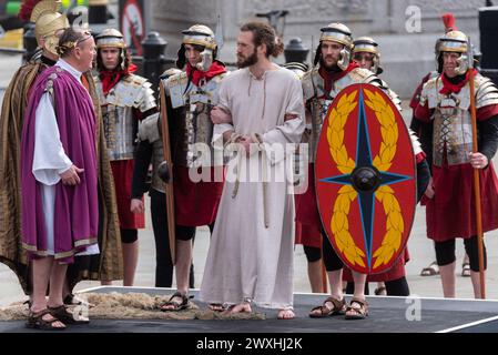 The Passion of Christ open air play by Wintershall in Trafalgar Square, London, on Easter Good Friday. Christ detained by Romans Stock Photo