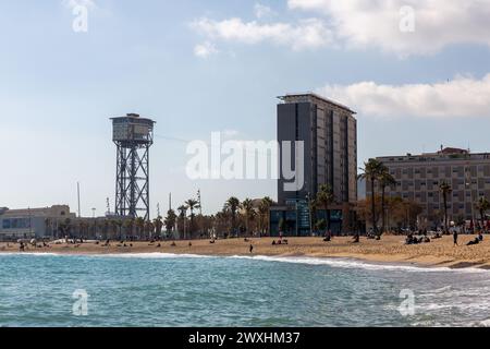 Barcelona, Spain - FEB 10, 2022: Torre Sant Sebastia is a 78 metre tall free standing lattice tower in Barcelona, Catalonia, Spain which is used as a Stock Photo