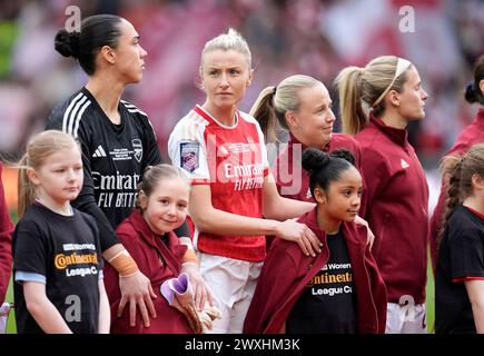 Arsenal’s Leah Williamson gives their jacket to a mascot ahead of the FA Women's Continental Tyres League Cup Final at Molineux Stadium, Wolverhampton. Picture date: Sunday March 31, 2024. Stock Photo