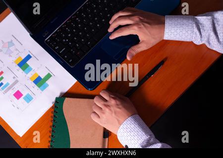 businessman working on his laptop, close-up of his hands Stock Photo