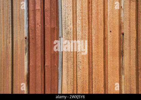 Colorful rusted weathered corrugated sheet metal closeup as gunge background Stock Photo