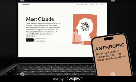 Istanbul, Turkey - 27 March 2024: Claude and Anthropic logo on smartphone screen with its website in background. Claude is a next generation AI assist Stock Photo