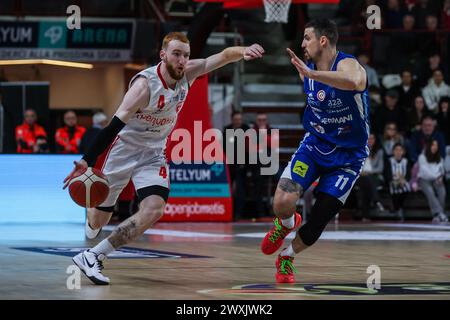 Niccolo Mannion #4 of Pallacanestro Varese OpenJobMetis (L) and John Petrucelli #11 of Germani Brescia (R) seen in action during LBA Lega Basket A 2023/24 Regular Season game between Pallacanestro Varese OpenJobMetis and Germani Brescia at Itelyum Arena. Final score; OJM Varese 92 : 95  Germani Brescia. Stock Photo